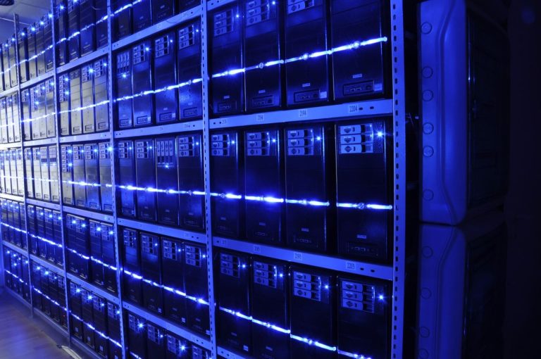 Data Centre Operators Race to Train the Engineers They Cannot Hire engineer working among rows of data centre servers
