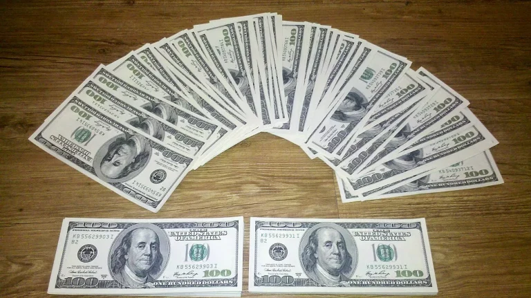 The Quiet Habits Behind Steady Wealth, Minus the Myths US dollar banknotes, representing household money, saving and steady wealth building