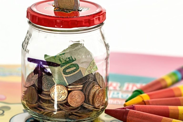 piggy bank surrounded by coins
