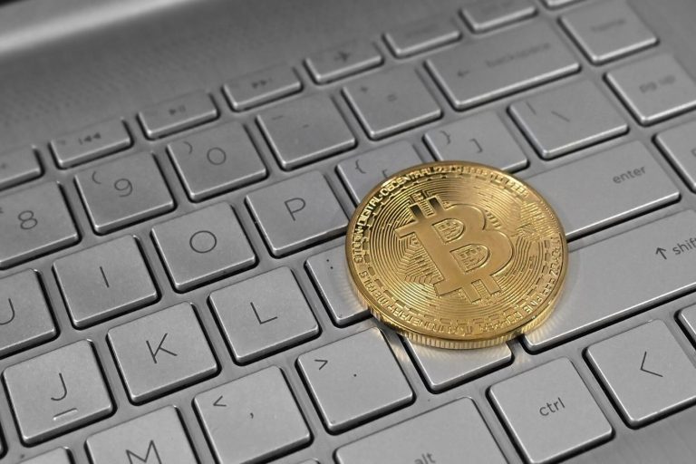 Crypto Index Funds Offer the Diversified Door Into Digital Assets Portfolio charts on a laptop